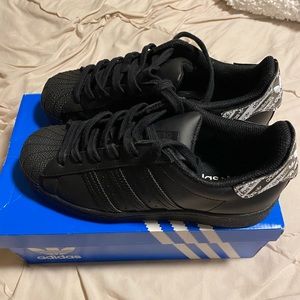 Boys Adidas Shell Toe Shoes.